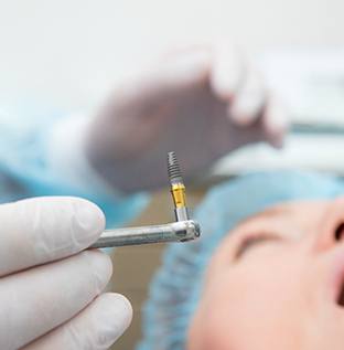 Oral surgeon placing dental implants in Kittanning, PA