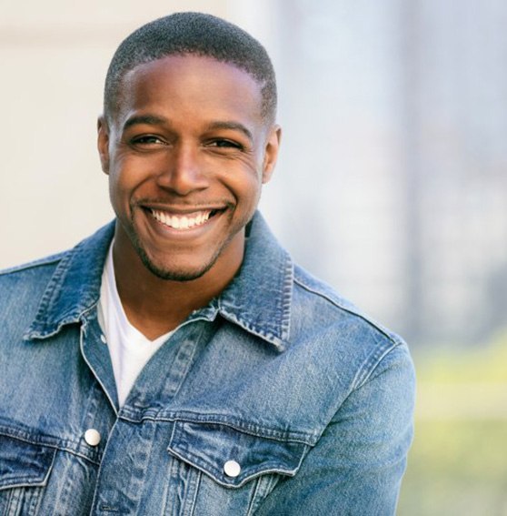 a man smiling with a bright smile