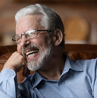 Man with dentures laughing