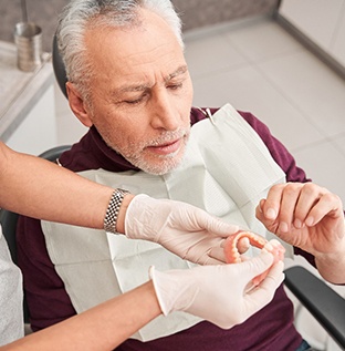 Man with dentures at the dentist