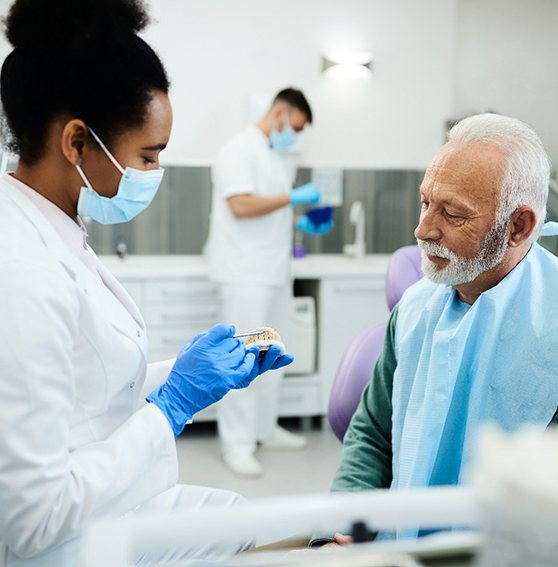 Man learning about dentures in Kittanning