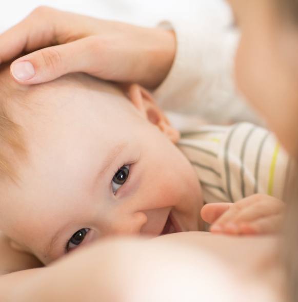 Mother and breast feeding baby