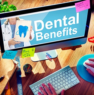Looking up dental benefits on the computer