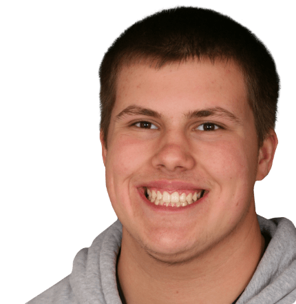 Young man sharing perfectly aligned smile after orthodontic treatment
