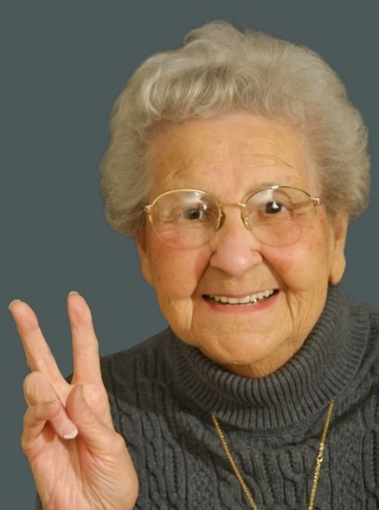 Real patient smiling after tooth replacement