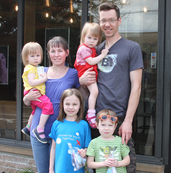 Parents and children smiling after silver diamine fluoride treatment