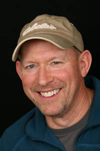 Man with perfectly aligned smile after dental crown restoration