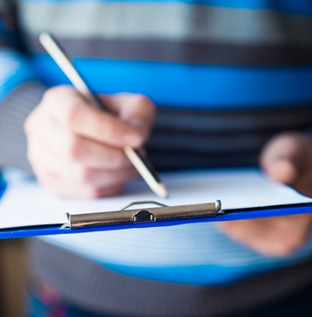 Individual filling out an insurance form