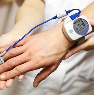 Individual checking a sleep apnea monitor on their wrist