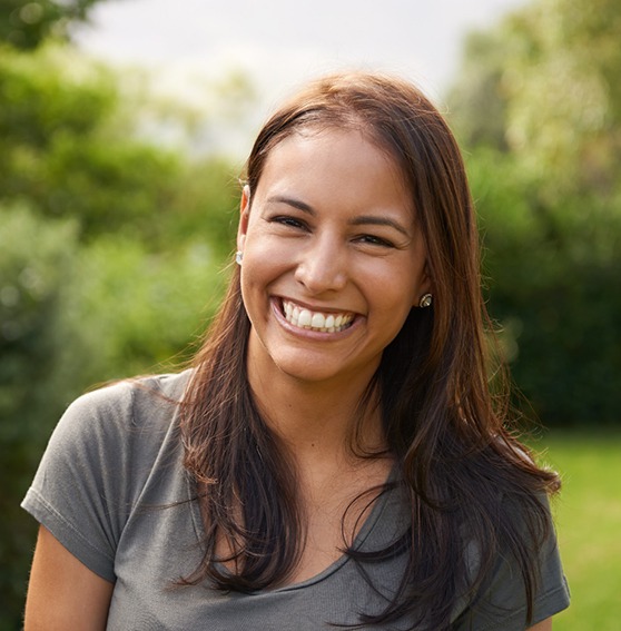 Woman with veneers in Kittanning, PA outside smiling