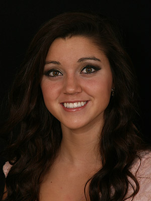 Young woman with perfected smile after porcelain veneers