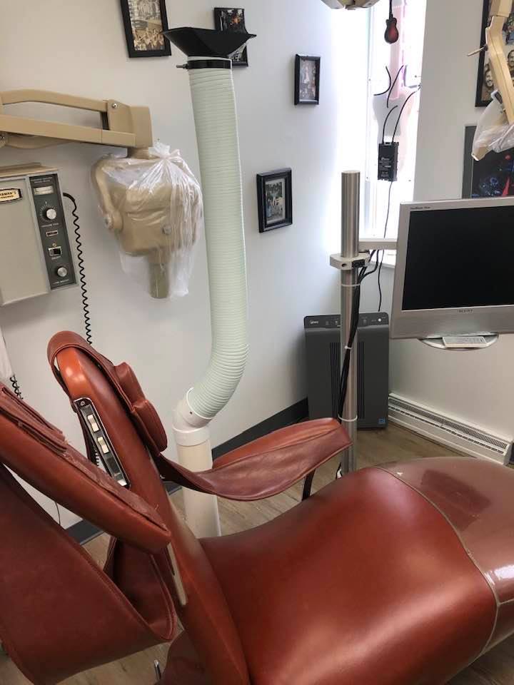 Dental office with brown chair and advanced equipment