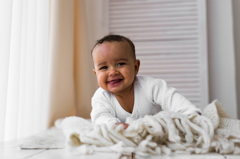 Happy baby with a tongue tie