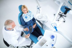 woman talking to her dentist 