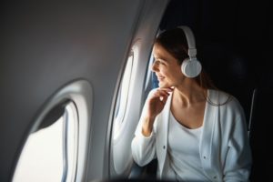 woman smiling on plane 