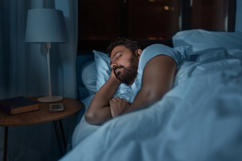 A man sleeping in bed