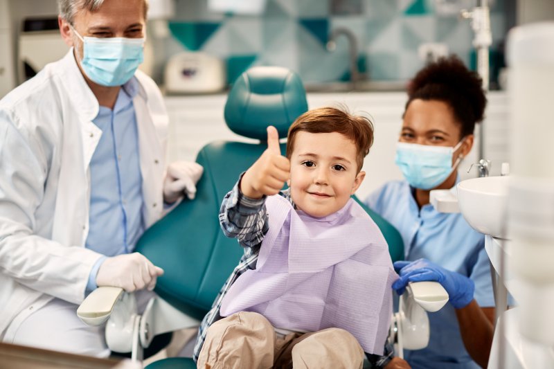 child giving thumbs up after a frenectomy